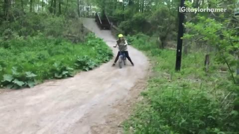 Girl in yellow green helmet dirt bike crash and fall