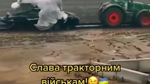 Ukrainian farmers with a captured Russian TOS-1A thermobaric MLRS BM-1 launcher
