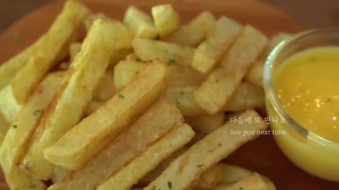 Fried Potatoes and cheese sauce __ French Fries