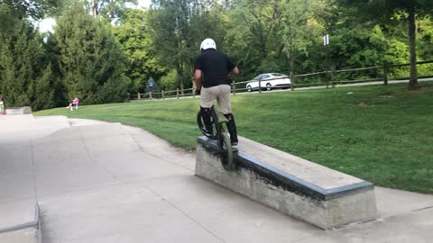 Kid Practicing BMX Goes Over the Handlebars