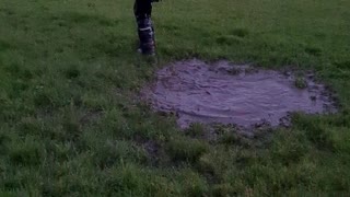 Kid Makes an Unexpected Jump into Mud Puddle