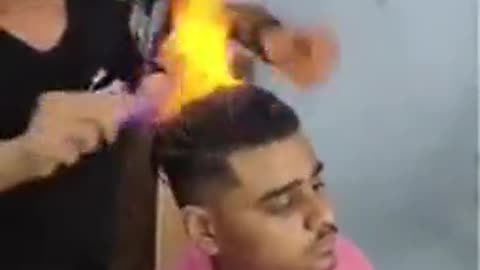 Head on fire, hillarous hairstyle gone wrong.