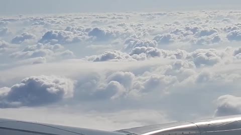 Blue sky and clouds-inside an airplane