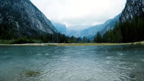 Rains Drops Over A Calm Blue Lake