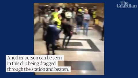 People run for cover as Iranian police open fire during protest at Tehran metro station