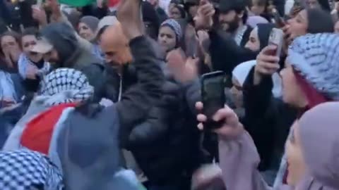 Anti-Israel protesters destroy an Israeli flag in Stockholm, Sweden