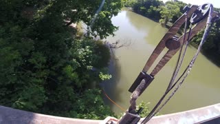 Incredible Bow Fishing Shot From a Bridge