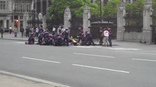 F1 racing car performs pit stop on London street