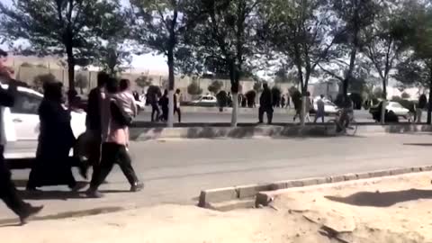 Afghans walk to Kabul airport, after Taliban takes control