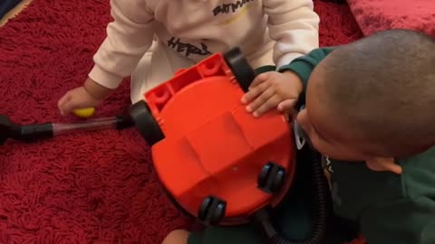 Baby karim’s playing with vacuum