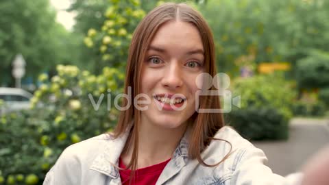 Pretty Young Woman Having A Video Call, Waving Hand At Camera Smiling 1