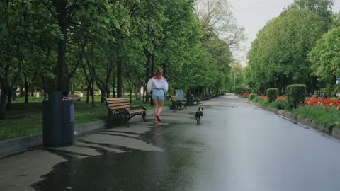 Woman Running at the Park with a Dog 2021