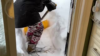 Woman Slips While Shoveling Snow