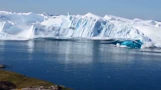 AMAZING FOOTAGE OF A NEWLY CALVED ICEBERG FLIPPING IN THE ILLULISSAT ICEFJORD GREENLAND