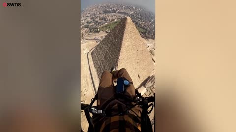 Paramotor pilot glides over Egypt's Pyramids and Sphinx _ SWNS