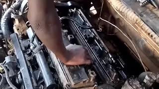 A 12 years old fixing a car