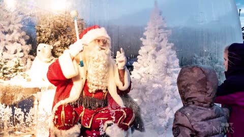 Santa greets kids from inside snow globe in Denmark