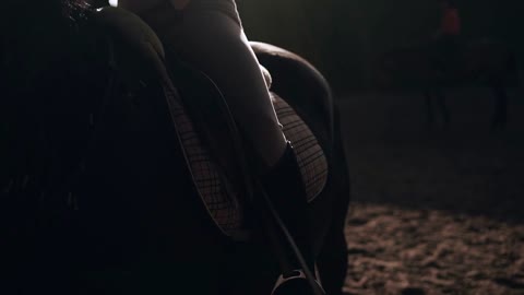 Mature rider woman sitting on a horse