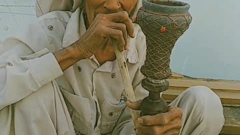 Old ladies smoke hukka