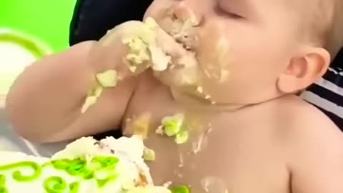 sweet baby eating cake