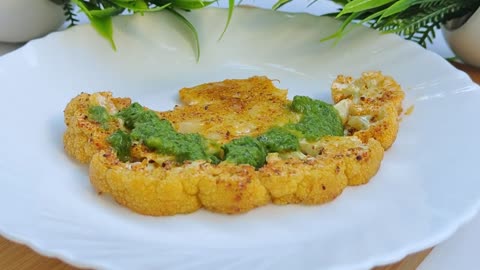 Cauliflower steak in the oven with lemon sauce. Simple and very tasty!