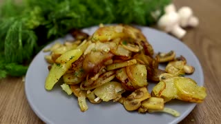 Recipe for delicious fried potatoes with mushrooms in a pan