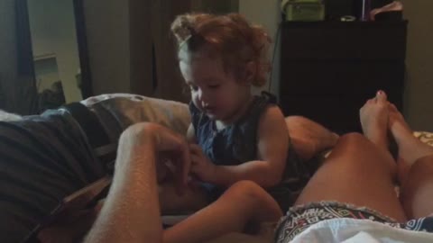 Jealous toddler competes with mommy for affection