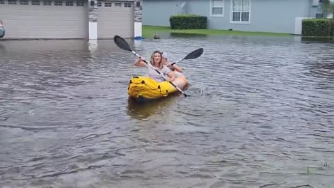 'We got Uber right here': People use kayaks to navigate Orlando's flooded streets