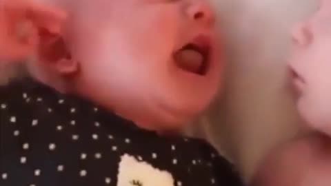 Baby stays shocked after seeing his baby brother crying right beside him