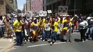 Free State ANC members march outside the ANC Luthuli house