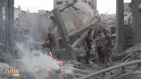 Palestinians Assess the Debris Left Behind After an Israeli Air Strike Destroyed a Mosque | News9