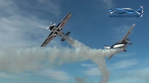 Two stunt pilots perform incredibly close flyby