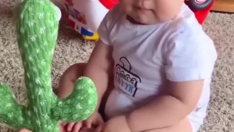 Babies play dancing cactus toy. Cutest baby funniest moments.