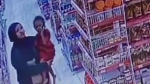 The actions of the mothers storing mini-market items in their clothes were recorded on CCTV.