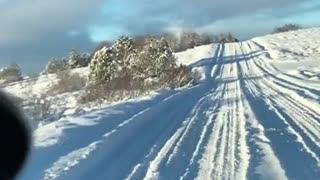 Range Rover driving in heavy snow.