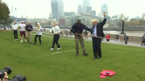 Boris Johnson takes a tumble in tug of war with armed forces - BBC News