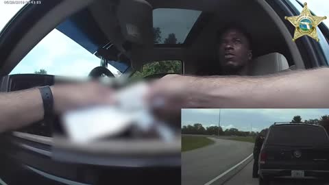 Florida Deputy's Body Cam Captures Him Hanging on Door as Suspect Flees Traffic Stop