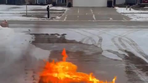 A METEOROLOGIST CREATED A STUNNING FIRE WHIRL AFTER USING GASOLINE TO REMOVE ICE FROM HIS DRIVEWAY