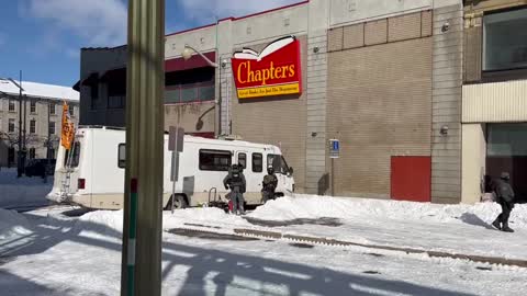 Police in Ottawa break into an RV at protest in Ottawa.