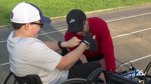 Spina bifida can't stop him from completing a marathon with his dad