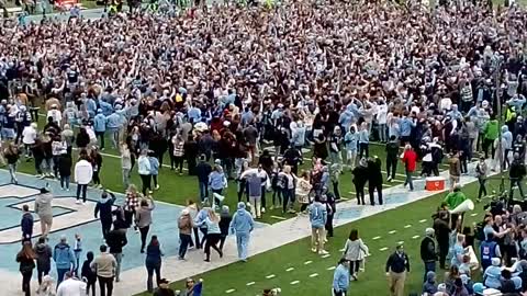 Wake Forest at UNC crowd rushed field.
