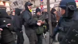 Woman hit in the face by one policeman in France