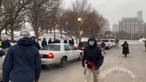 Patriot Front members load up their shields and flags outside Soldier Field here in Chicago