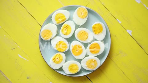 Boiled chicken eggs on a blue ceramic plate The concept of Easter Holidays