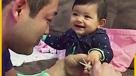 Overdramatic baby scares Dad when cutting her nails