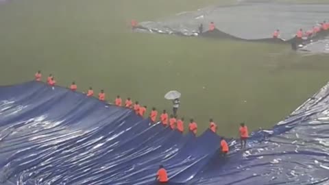 Heavy rain at R Premadasa stadium in Colombo, ground staff struggling to cover the ground #INDvsPAK