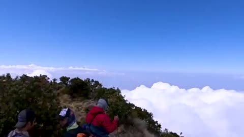 BEAUTIFUL VIEWS OVER THE CLOUDS. TOWARDS THE TOP OF MOUNT ARJUNO