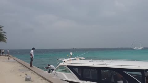 Seaplane lands across wind in heavy sea in Kuredu atol in Maldives.