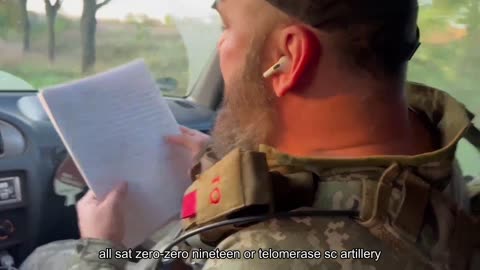 An officer of the Armed Forces reads the reports of Russian soldiers and officers. They were found