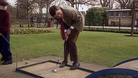 Mr. Bean playing golf